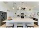 Bright kitchen with white cabinetry, stainless appliances and a large island at 9404 Arnaz Cir, Port Charlotte, FL 33981