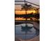 Relax and unwind in this screened in pool, reflecting the colors of a beautiful Florida sunset at 9404 Arnaz Cir, Port Charlotte, FL 33981