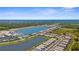 Breathtaking aerial view of a lakeside community, highlighting its layout and access to waterfront at 9853 Bright Water Dr, Englewood, FL 34223