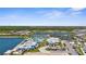 Scenic aerial view of a community with lakes, tennis courts, a swimming pool, and spacious parking at 9853 Bright Water Dr, Englewood, FL 34223