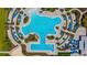 Aerial view of the stunning resort-style pool, complete with ample lounge chairs and beautiful landscaping at 9853 Bright Water Dr, Englewood, FL 34223