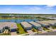 Desirable neighborhood with lake views and well-maintained homes, featuring attached garages and brick driveways at 9853 Bright Water Dr, Englewood, FL 34223