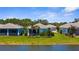 Charming single-Gathering homes with tropical landscaping and waterfront views at 9853 Bright Water Dr, Englewood, FL 34223