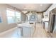Stylish kitchen featuring a center island with seating and modern appliances at 9853 Bright Water Dr, Englewood, FL 34223