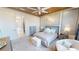 Luxurious main bedroom with a tray ceiling, soft lighting, and ensuite bathroom access at 9853 Bright Water Dr, Englewood, FL 34223
