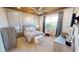 Well-appointed main bedroom featuring soft decor, a tray ceiling, and plenty of natural light at 9853 Bright Water Dr, Englewood, FL 34223