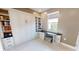 Home office features a Murphy bed, built-in bookshelves, and a built-in desk space at 9853 Bright Water Dr, Englewood, FL 34223
