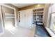 Office features a Murphy bed and built-in bookshelves with natural light from the window at 9853 Bright Water Dr, Englewood, FL 34223