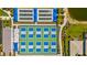 Overhead view of well-maintained sports courts, including bocce ball and pickleball at 9853 Bright Water Dr, Englewood, FL 34223
