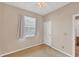 Bedroom featuring plush carpeting, ceiling fan, and neutral walls at 10495 Atenia St, Port Charlotte, FL 33981