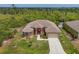 Expansive single-story home featuring a spacious lawn and a mature tree buffer for exceptional privacy at 10495 Atenia St, Port Charlotte, FL 33981