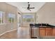 Bright eat-in kitchen with granite counters, wood cabinets, and a seamless flow to the lanai at 10495 Atenia St, Port Charlotte, FL 33981