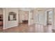 Open living space with tile floors, neutral paint, and open access to the kitchen and dining area at 10495 Atenia St, Port Charlotte, FL 33981