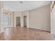 Open-concept living room features tile flooring, neutral walls, and plenty of natural light from the sliding doors at 10495 Atenia St, Port Charlotte, FL 33981