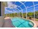 Inviting screened-in pool showcasing a tranquil outdoor living space at 10495 Atenia St, Port Charlotte, FL 33981