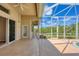 Pool patio with screened-in enclosure and access to the home's interior at 10495 Atenia St, Port Charlotte, FL 33981