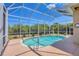 Screened-in pool featuring clear blue water and a spacious deck area at 10495 Atenia St, Port Charlotte, FL 33981