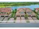 Exceptional aerial view of the community featuring stunning lake views and beautiful landscaping at 10805 Tarflower Dr # 101, Venice, FL 34293
