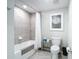 Bathroom featuring a tiled shower/tub, toilet and a decorative art piece at 10805 Tarflower Dr # 101, Venice, FL 34293