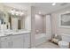 Bathroom featuring a tub/shower combo, vanity, toilet, and great lighting at 10805 Tarflower Dr # 101, Venice, FL 34293
