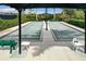 Bocce ball courts with shaded seating areas, ideal for outdoor leisure and socializing at 10805 Tarflower Dr # 101, Venice, FL 34293