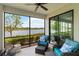 Relax on this lanai with a great view of the lake and comfy outdoor furniture at 10805 Tarflower Dr # 101, Venice, FL 34293