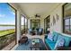 This screened lanai offers serene views of the water and plenty of comfortable seating at 10805 Tarflower Dr # 101, Venice, FL 34293
