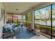 Screened lanai offering serene water views and plenty of seating at 10805 Tarflower Dr # 101, Venice, FL 34293