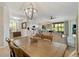 Open-concept living and dining area with a view to the kitchen, offering a comfortable and inviting space at 10805 Tarflower Dr # 101, Venice, FL 34293