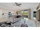 Open-concept living space showcasing the kitchen, comfortable seating, and a view of the outdoors, perfect for entertaining at 10805 Tarflower Dr # 101, Venice, FL 34293