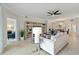 Comfortable living room with stylish decor, tile floors, and an open view to the dining area and adjacent spaces at 10805 Tarflower Dr # 101, Venice, FL 34293