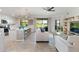 Bright open-concept living area with modern furnishings and kitchen access, perfect for hosting at 10805 Tarflower Dr # 101, Venice, FL 34293