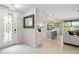 Inviting entryway flowing into an open-concept living area with a kitchen view and modern decor at 10805 Tarflower Dr # 101, Venice, FL 34293