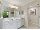 Bright bathroom featuring a and sink and an entrance to the toilet at 10805 Tarflower Dr # 101, Venice, FL 34293