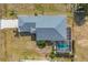 Aerial view of the house showing the pool, backyard, and driveway at 12359 Deepwoods Ave, Port Charlotte, FL 33981