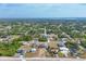 Distant overhead shot of a neighborhood with a lake in the background at 12359 Deepwoods Ave, Port Charlotte, FL 33981