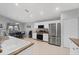 Kitchen with stainless steel appliances, granite countertops, and white cabinetry at 12359 Deepwoods Ave, Port Charlotte, FL 33981
