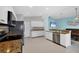 Modern kitchen design with stainless steel appliances and white cabinetry at 12359 Deepwoods Ave, Port Charlotte, FL 33981