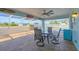 Covered patio featuring comfortable seating and a view of the sparkling pool, perfect for relaxation and entertainment at 12359 Deepwoods Ave, Port Charlotte, FL 33981