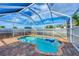 Enclosed pool area with brick decking and a metal safety fence at 12359 Deepwoods Ave, Port Charlotte, FL 33981
