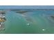 Beautiful aerial view of boats sailing in clear blue waters near lush islands at 1245 Gulf Blvd, Englewood, FL 34223