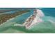 Scenic aerial view of the coastline with turquoise waters and sandy shores at 1245 Gulf Blvd, Englewood, FL 34223