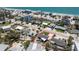 An aerial view of a single-story home with a pool and waterfront access close to the beach at 1245 Gulf Blvd, Englewood, FL 34223