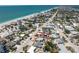 Aerial view showing the property outlined in red, close to the beach and near other homes at 1245 Gulf Blvd, Englewood, FL 34223