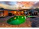Aerial view of a backyard featuring a pool, spa, covered patio, and outdoor seating area at 1245 Gulf Blvd, Englewood, FL 34223