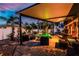 Lovely backyard featuring a pool, spa, covered patio, comfortable seating, and meticulously maintained landscaping at 1245 Gulf Blvd, Englewood, FL 34223