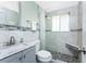 Modern bathroom featuring tiled shower, granite vanity top, and neutral color palette at 1245 Gulf Blvd, Englewood, FL 34223