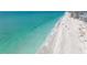 Stunning view of a serene beach with crystal-clear turquoise water and soft white sand at 1245 Gulf Blvd, Englewood, FL 34223