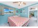 Cozy bedroom with a ceiling fan, nautical decorations, and view into the living area at 1245 Gulf Blvd, Englewood, FL 34223