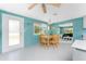 Cozy dining area with bright lighting, complimented by an open floor plan into living room at 1245 Gulf Blvd, Englewood, FL 34223